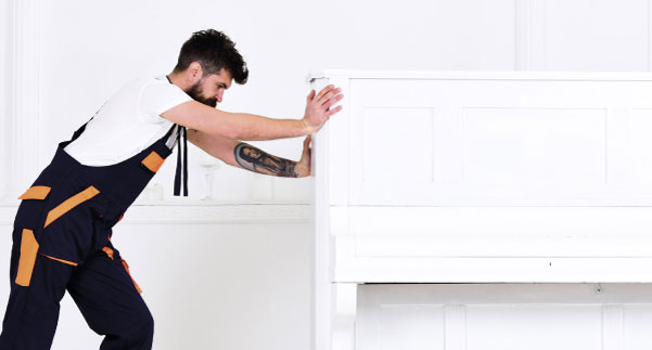 Buzz Movers specialist team hoisting a piano during a specialist furniture removal